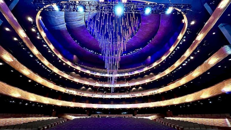 a large theater with a stage and seating