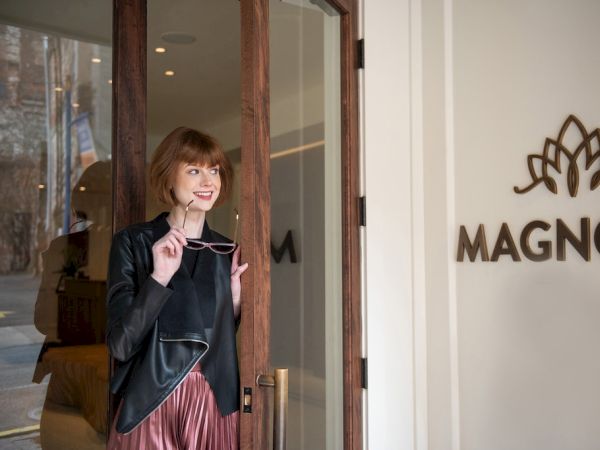 A person standing by a door with 