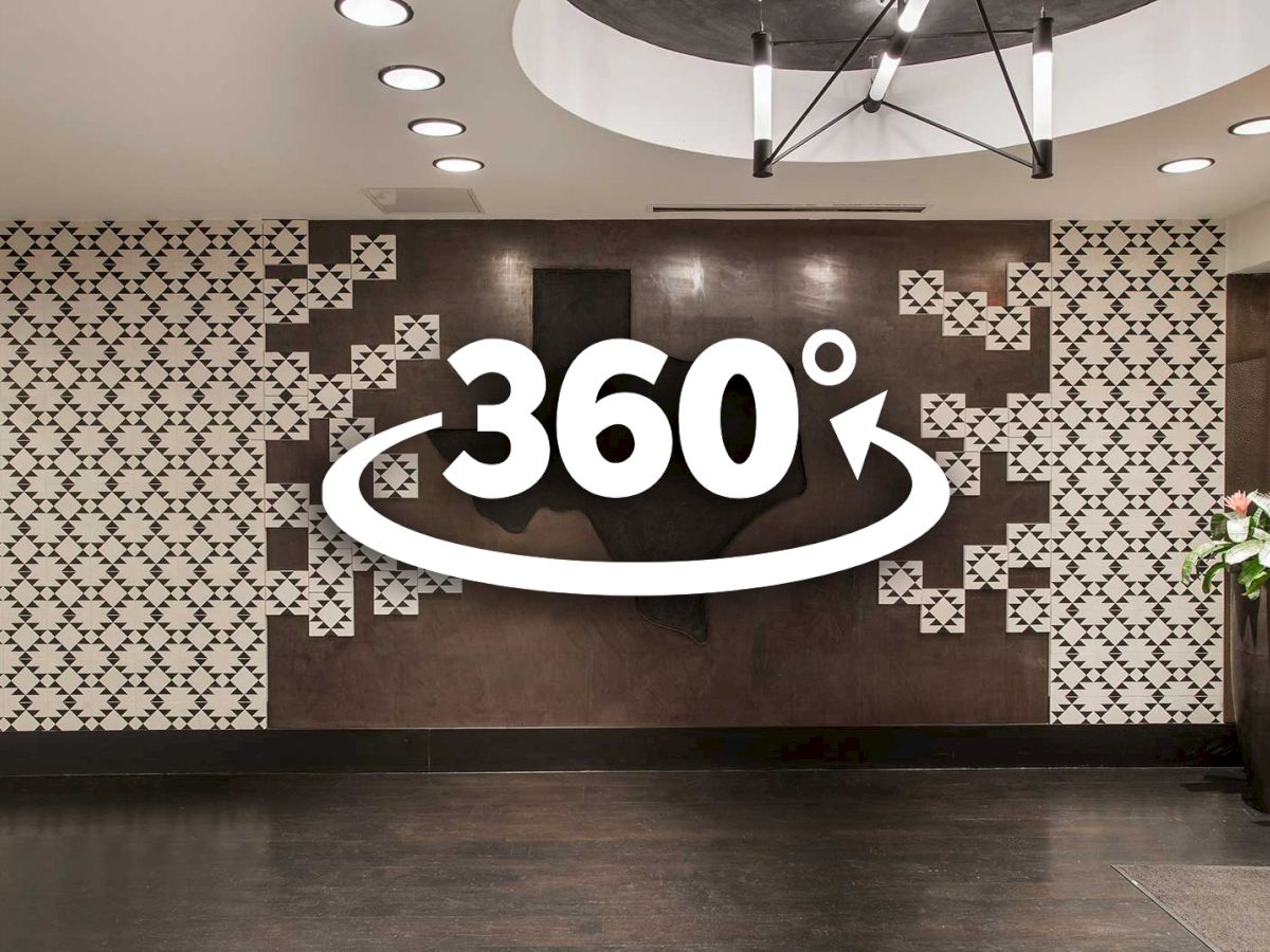 The image shows a stylish interior with a patterned wall and a large 